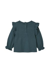 Teal farbenes Langarmoberteil aus weichem Stoff, mit Rüschenschultern und Ballonärmel mit elastischen Bünde sowie einer Knopfverschluss auf der Rückseite.