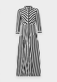 Robe longue rayée verticalement noir et blanc, manches longues, boutonnée sur le devant avec un col.
