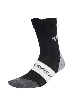Chaussette de sport noire et grise avec un coussinet aux orteils et au talon. Présente une bande blanche avec le logo "TERREX" et un design côtelé au niveau de la cheville.