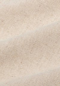 Light beige woven fabric with a textured surface, featuring a diagonal pattern and subtle variations in color. Durable and natural material.