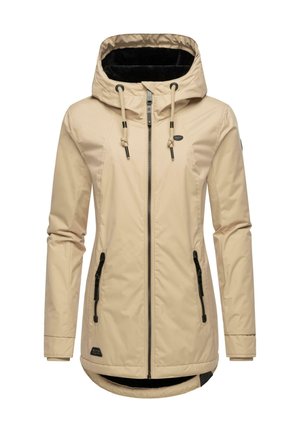 Beige waterdichte jas met capuchon, voorzien van zwarte ritsen en een zachte zwarte binnenvoering. Inclusief trekkoorden en een langere achterkant.