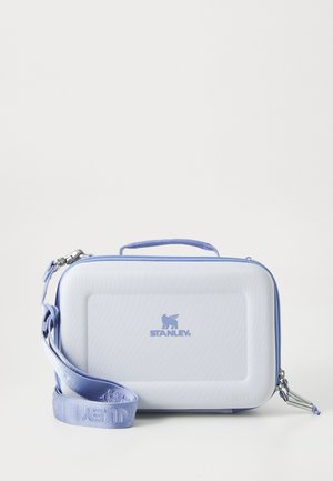 Light blue rectangular hard-shell case with a textured surface, zip closure, carrying handle, and detachable matching strap featuring the Stanley logo.