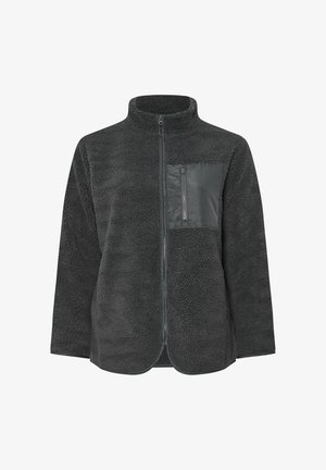 Veste en polaire gris foncé avec un col haut, une fermeture éclair à l'avant et un corps texturé. Dotée d'une poche poitrine lisse avec un détail de fermeture éclair.