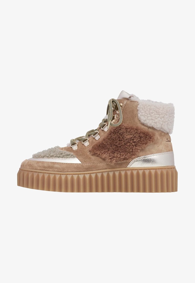Textured brown suede high-top sneaker with cream accents, metallic detailing, and a thick, ribbed rubber sole. Features lace-up design.