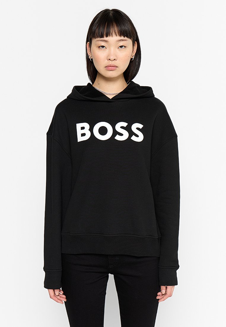 Zwarte oversized hoodie van zachte stof met een witte "BOSS"-logo over de borst. Inclusief een capuchon met trekkoord en geribbelde manchetten.