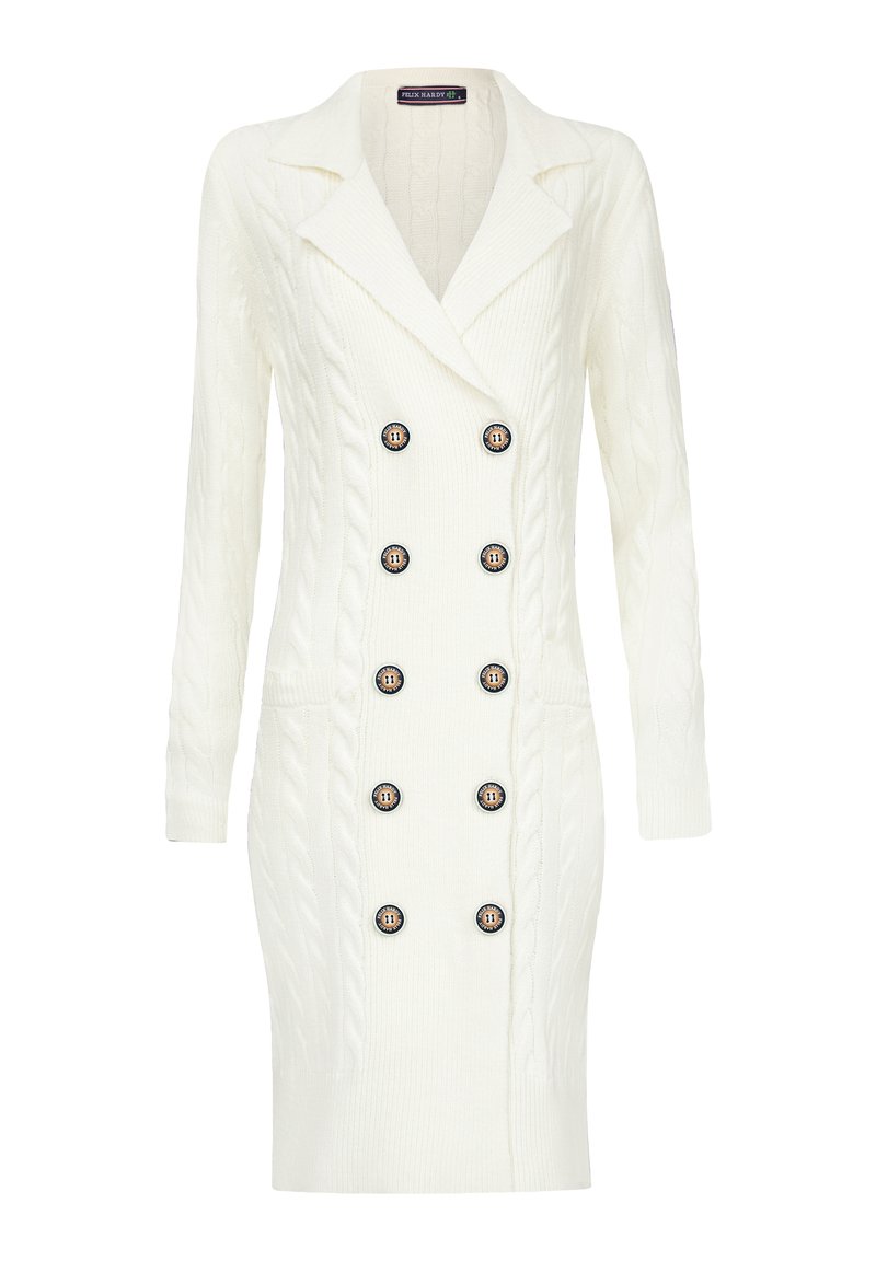 Robe en tricot blanc à mailles avec un design à double boutonnage, huit grands boutons noirs avec des accents dorés et deux poches latérales.