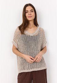 Beige knitted sweater with a loose, open weave, V-neck design, and rolled short sleeves. Textured surface adds depth to the fabric.