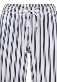 White pajama pants with narrow navy stripes, featuring an elastic waistband and a light pink drawstring. Soft, lightweight fabric texture.