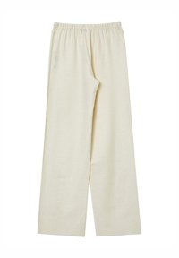 Pantaloni a gamba wide di colore crema, realizzati in tessuto morbido, con vita elastica e senza motivi o hardware visibili.