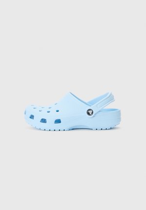 Light blue clog made of soft, durable material. Features ventilation holes and a back strap for secure fit. Textured sole for grip.