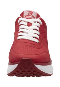 Red athletic shoe with a smooth suede upper, white laces, and a cushioned sole featuring a textured, dotted pattern. Accented logo on tongue.