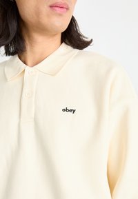 Obey Clothing LOWERCASE - Hosszú ujjú felső - unbleached