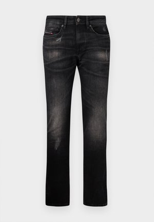 Black denim jeans feature a straight leg cut, faded texture, and subtle distressing. Includes standard pockets and a button closure.