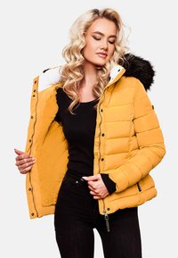 Yellow puffer jacket with a faux fur-lined hood. Features a zip closure, ribbed cuffs, and soft inner lining. Shiny exterior with quilted texture.