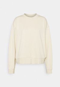 Felpa color crema, realizzata in tessuto morbido, presenta una vestibilità comoda, scollatura rotonda e maniche lunghe con polsini e orlo a costine.