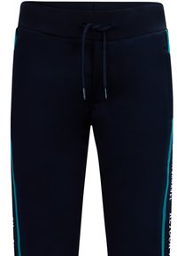 Navy Jogginghosen aus weichem Stoff. Mit einem Kordelzugbund, seitlichen Streifen in Türkis und weißem Text entlang der Seitennaht.