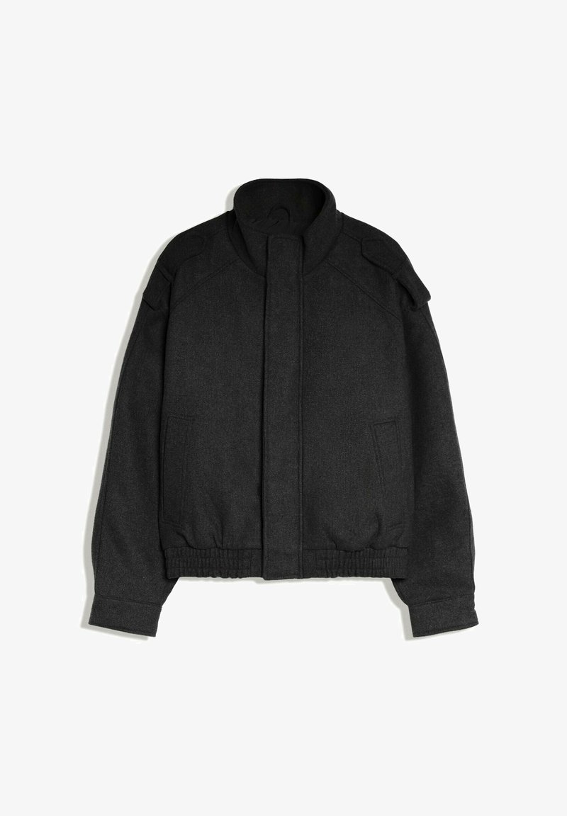 Veste bomber en laine noire avec col montant, fermeture à rabat devant, manches longues, ourlet élastique et poches latérales, présentée sur fond blanc.