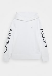 Vit huvtröja med ribbade ärmslut. Har en svart logotyp på bröstet och fet svart text "CALVIN" längs en ärm.