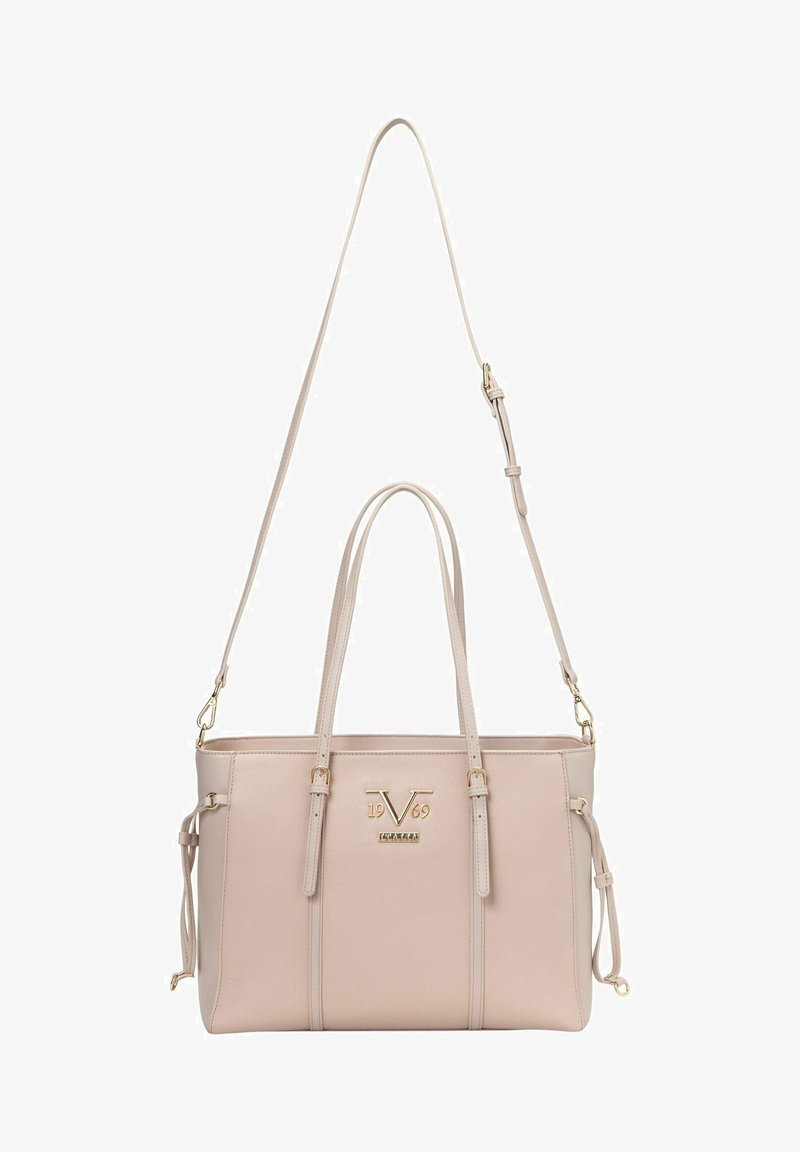 Beżowa torebka syntetyczna z złotymi akcentami, podwójnymi uchwytami u góry, odpinanym paskiem na ramię oraz wyraźnym logo z przodu.