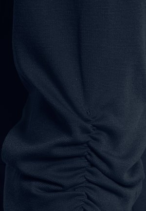 Navy blue fabric with a textured weave, featuring gathered stitching along the side for a ruched effect and smooth finish.