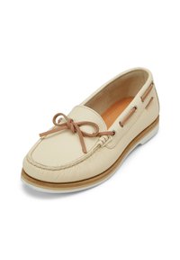Beige nahkakengät, joissa on teksturoitu pinta, sidontanauha koristeena, sivuaukot ja vaaleanruskea kumipohja.