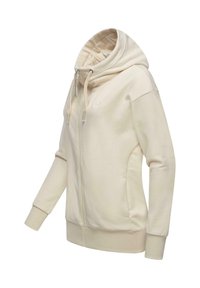Sweat-shirt zippé beige avec capuche à cordon, poignets côtelés et poches latérales. Il présente un tissu doux et un discret logo sur la poitrine.