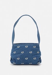 Denim shoulder bag in dark blue, featuring an all-over light beige pattern of interlocking circles. Soft texture with a single sturdy strap.