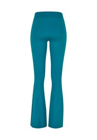 Pantaloni da yoga a zampa d'elefante in turchese con una ampia cintura elastica. Tessuto liscio ed elasticizzato con un taglio classico che si estende dal ginocchio alla caviglia.