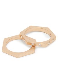Gold-tone metal hexagonal rings with a smooth finish, featuring five small embedded clear crystals on one band.