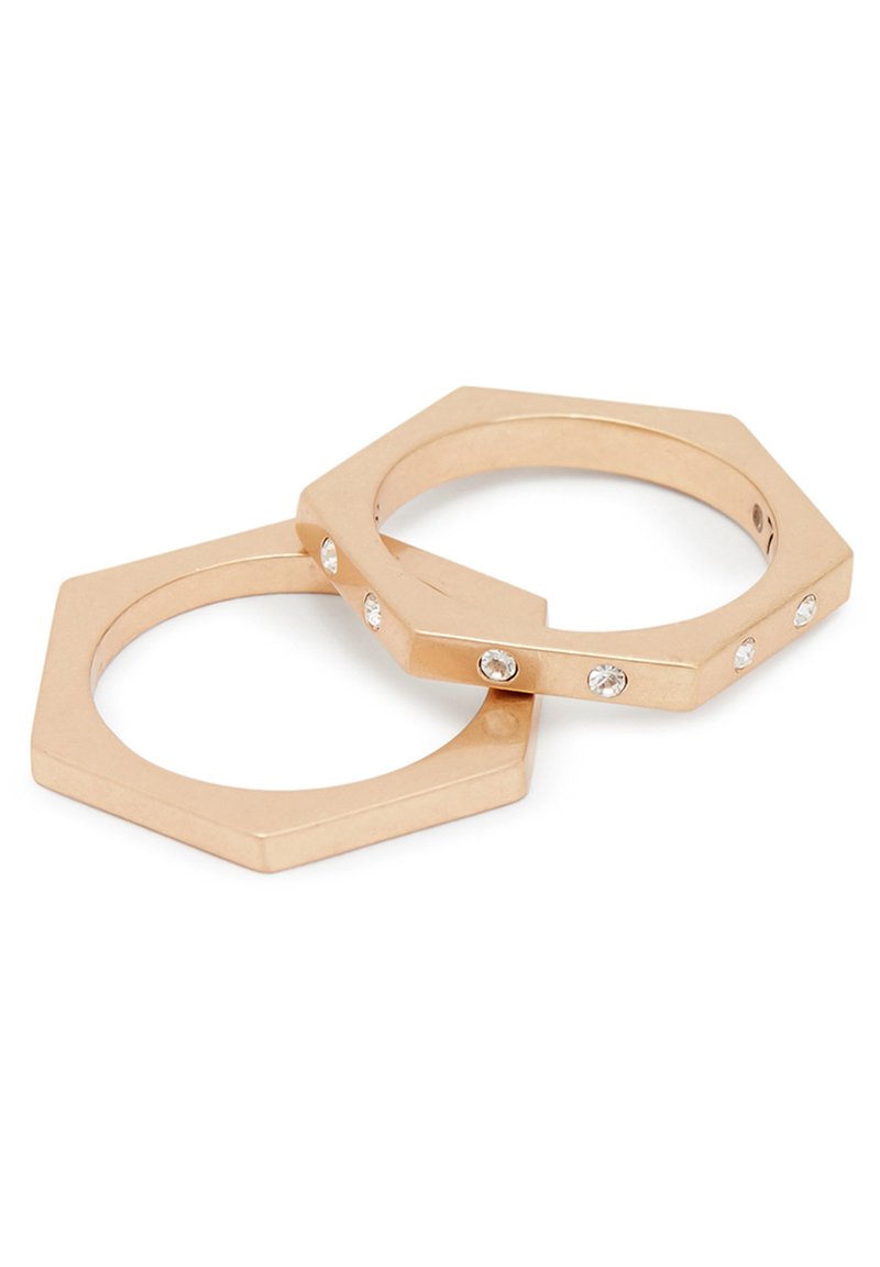Gold-tone metal hexagonal rings with a smooth finish, featuring five small embedded clear crystals on one band.