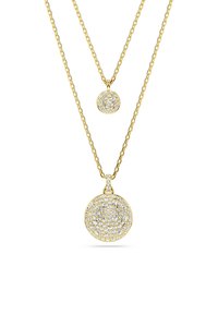 Kuldtooni kaelakeed, millel on kaks eri suurusega ümmargust ripatsit, kaunistatud mitme selge kristalliga, sisaldavad keerduvaid ketilinke.