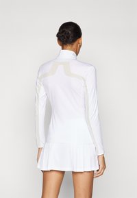 J.LINDEBERG Sports SEASONAL JANICE MID LAYER - Sportinė striukė - white