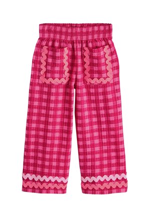 Pink checkered pants with elastic waist, two front pockets outlined in wavy trim, and matching wavy trim near the hem.