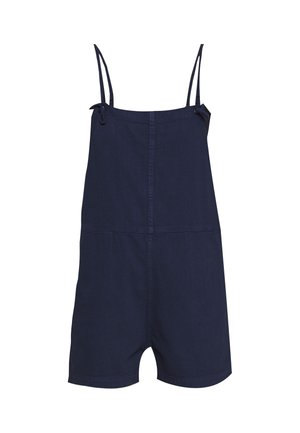 Tummansininen farkkuhaalari, jossa on ohuet säädettävät olkaimet, edessä sauma ja rento istuvuus, sekä kaksi sivutaskua.