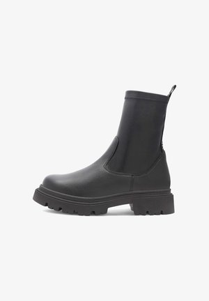 Mustad mustjalats, mis on valmistatud siledast sünteetilisest nahast, omab tugevat kummist tallat, külgmisi elastseid paneele ja tõmblinti mugavaks kasutamiseks.