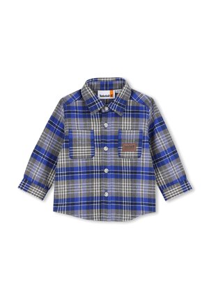 Chemise à carreaux bleue, grise et blanche à manches longues, boutonnée, avec deux poches poitrine, dont l'une présente un patch logo Timberland.