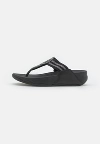 Black flip-flop with a textured rubber sole, featuring a wide, striped fabric strap and a circular design accent on the toe post.
