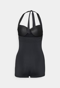 Maillot de bain noir une pièce avec une coupe ajustée, des bretelles à nouer derrière le cou et des bonnets rembourrés doux. Le tissu est lisse avec une texture extensible.