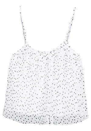 Biała bezrękawnik z cienkimi ramiączkami, z małymi nieregularnymi czarnymi groszkami i luźnym, zwiewnym krojem.