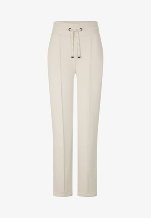Proste spodnie w kolorze kremowym z detalami w formie szwu z przodu oraz ściągaczem w pasie ze sznurkami zakończonymi metalowymi końcówkami.