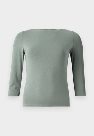 Mintgrön, åtsittande långärmad topp med en vid halsringning och trekvartslånga ärmar. Tillverkad av ett mjukt, stretchigt tyg med minimala sömmar.