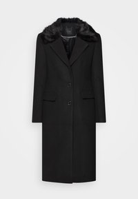 Abrigo de lana negro con cuello de piel, dos bolsillos frontales, botones y una silueta larga. Textura suave con un diseño a medida.