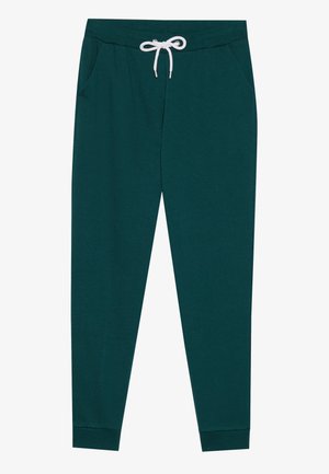 Teal jogger-housut, jotka ovat pehmeää kangasta, elastisella vyötärönauhalla, valkoisella nyörillä, sivutaskuilla ja kapenevilla lahkeilla.