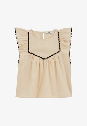 Blouse sans manches crème avec bordure en croquet noir le long du décolleté carré et manches volantées, avec une fermeture à boutons au dos.