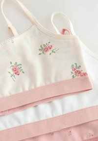 Pillekönnyű bralette szett pasztell árnyalatokban. Virágmintás, csipkebetétek és rózsaszín, fehér elasztikus pántok jellemzik. Puha pamut anyag.