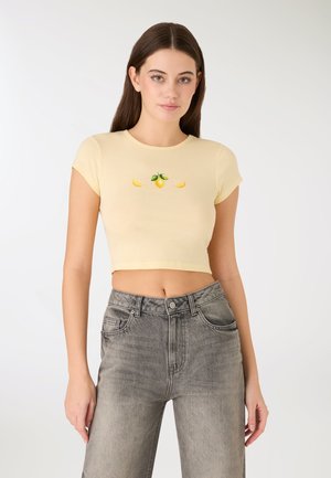 T-shirt con stampa - giallo chiaro