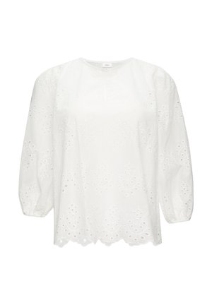 Blouse en coton blanc avec manches ballon, motif en broderie anglaise, col rond et ourlet festonné. Design simple et léger.