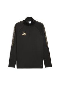 Svart sportspullover med lång ärm, guld Puma-logotyp och texten "KING", halvdragkedja i kragen och mönstrade guldstrimmor på ärmarna.