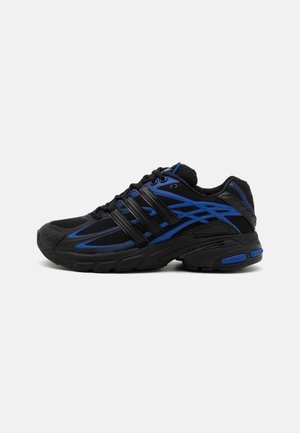Black athletic shoe featuring blue accents, mesh upper, and rubber sole with a textured pattern. Includes laces and side stripes design.