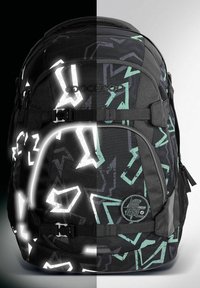 Black backpack with reflective white and teal geometric patterns. Features adjustable straps, a side pocket, and a circular logo detail.